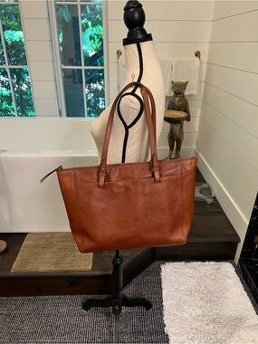 Fossil cow hide tote dark brown